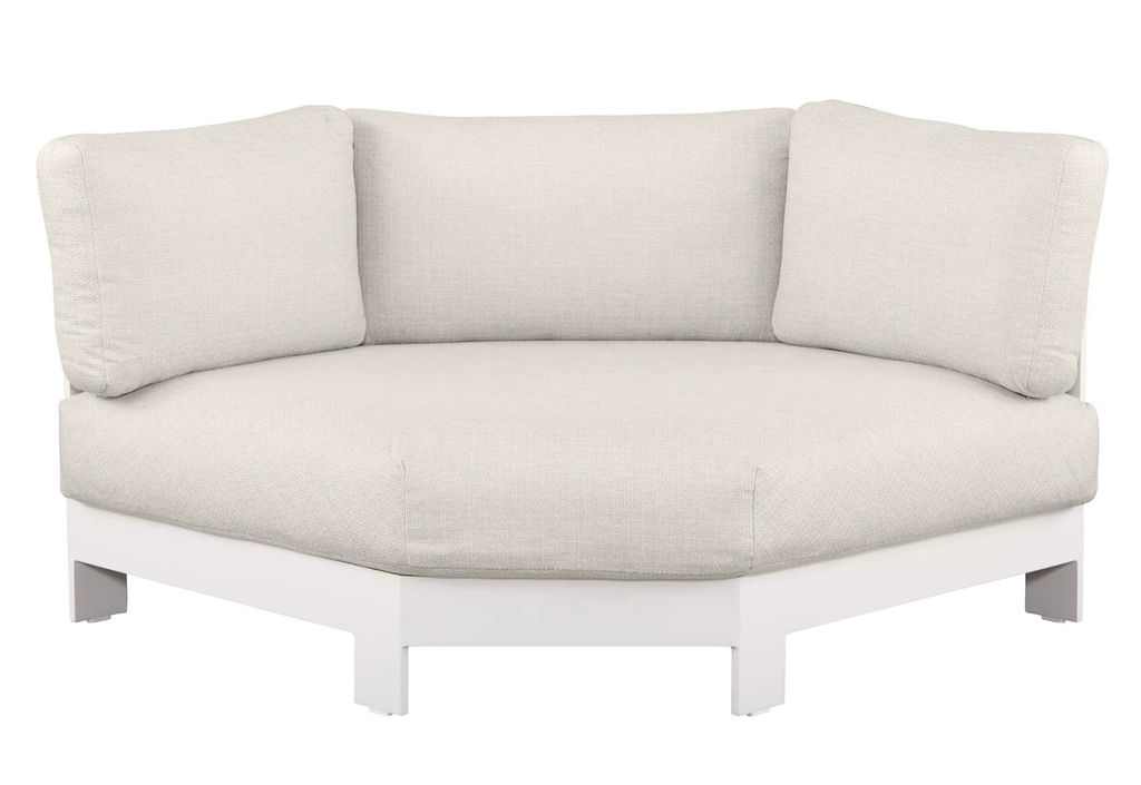 White outdoor lounge set with curved sofa and coffee tables beside a pool