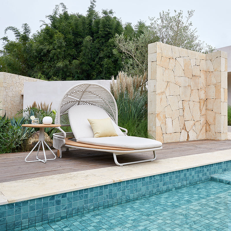 ALMA outdoor chaise lounge beside a swimming pool