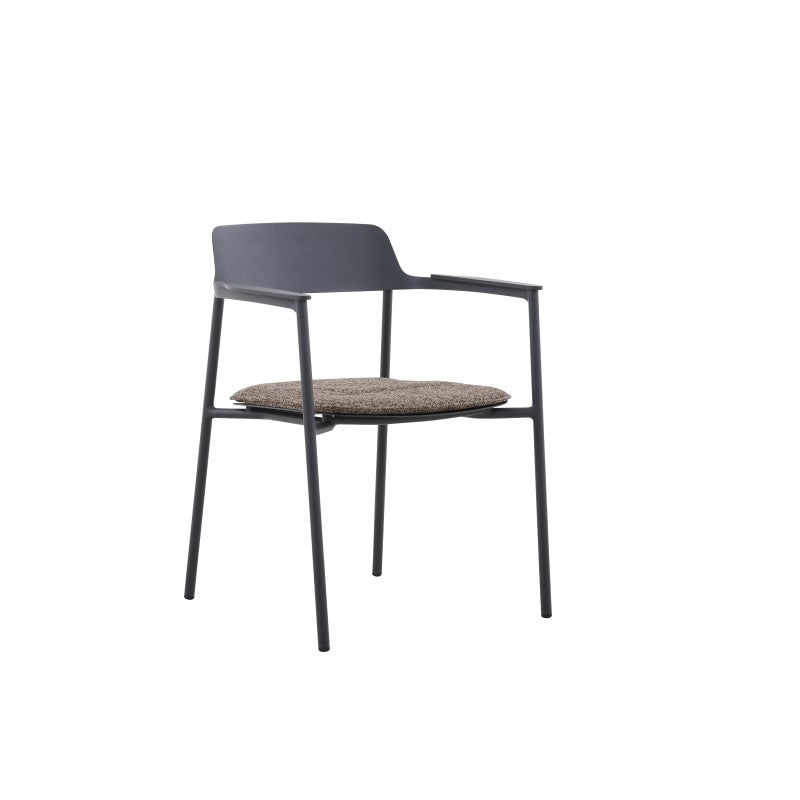 Angled view of the AURORA black outdoor dining armchair with curved backrest and arms