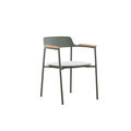 Angled view of the AURORA dark green outdoor dining armchair with teak arms