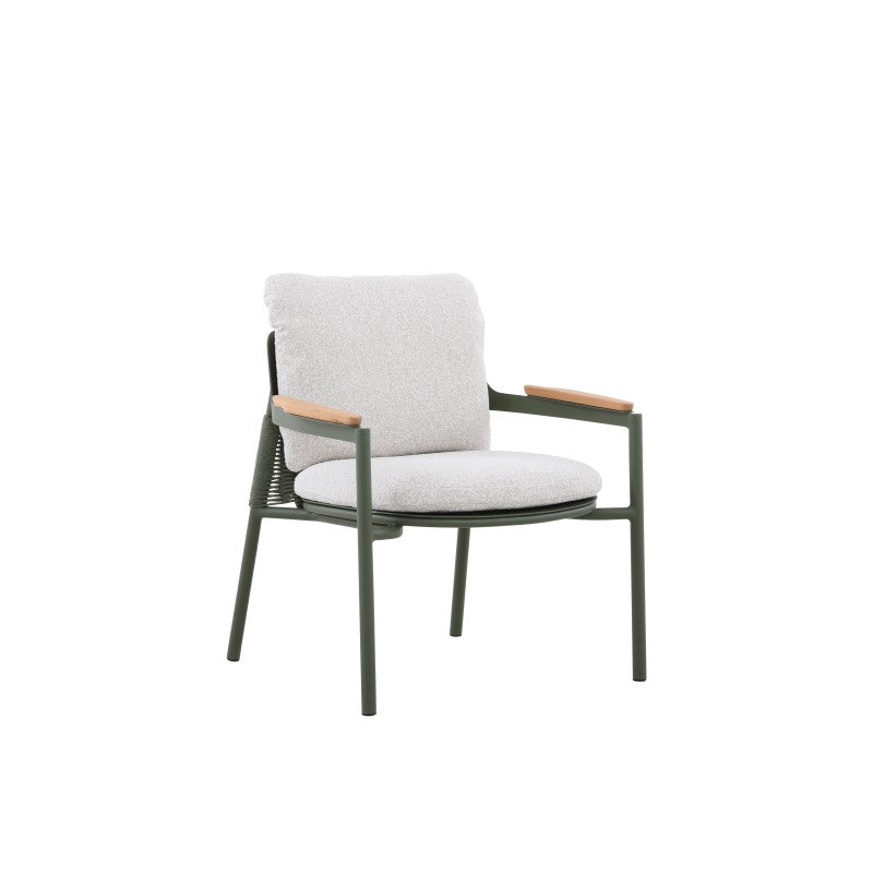 Angled view of the AURORA dark green outdoor lounge chair with teak arms and cushions