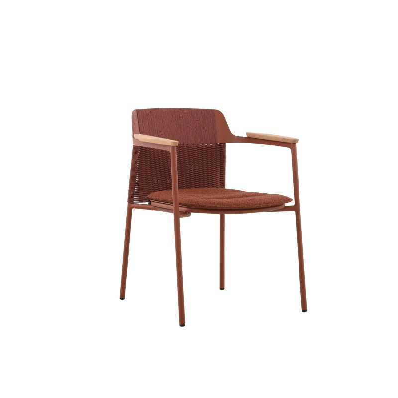 Angled view of the AURORA rust red woven outdoor dining chair with teak arms