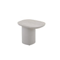 Angled view of the COCOON outdoor side table with rounded tabletop and cylindrical base