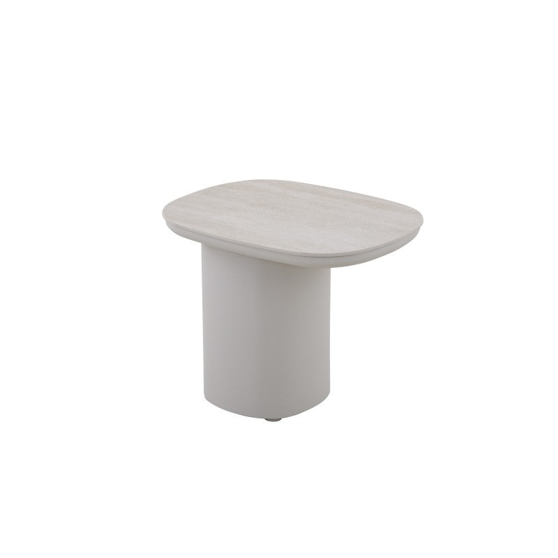 Angled view of the COCOON outdoor side table with rounded tabletop and cylindrical base