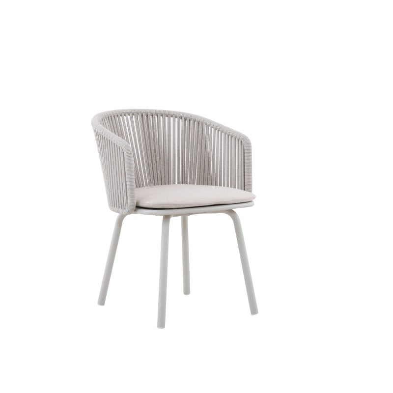 Angled view of the LA TOUR white rope-woven outdoor dining armchair with light seat cushion