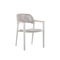 Angled view of the LA TOUR white woven outdoor dining armchair with teak arms