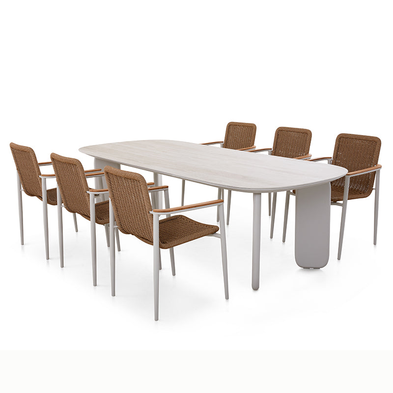 VENTO outdoor dining table styled with woven outdoor dining chairs