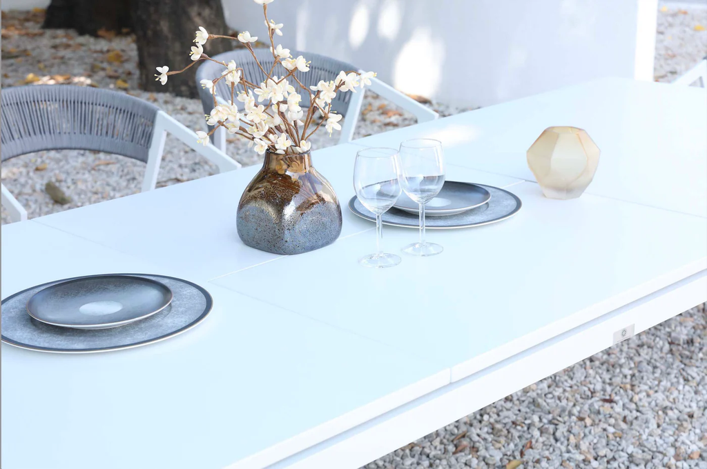 Detail of the white tabletop on the extendable outdoor dining table