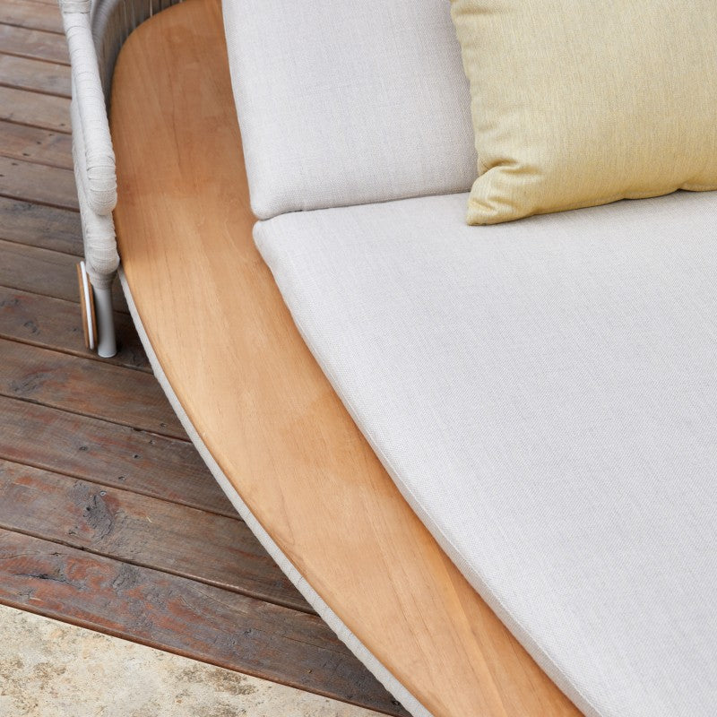 ALMA outdoor chaise lounge with curved woven rope back and light cushions