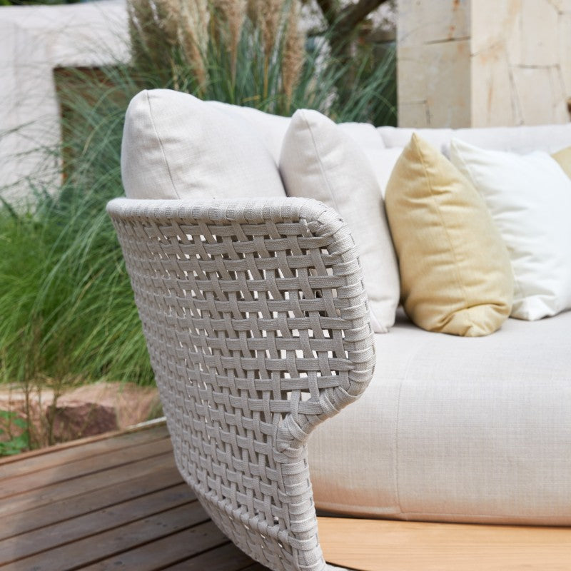 ALMA round outdoor daybed with light cushions and woven rope surround