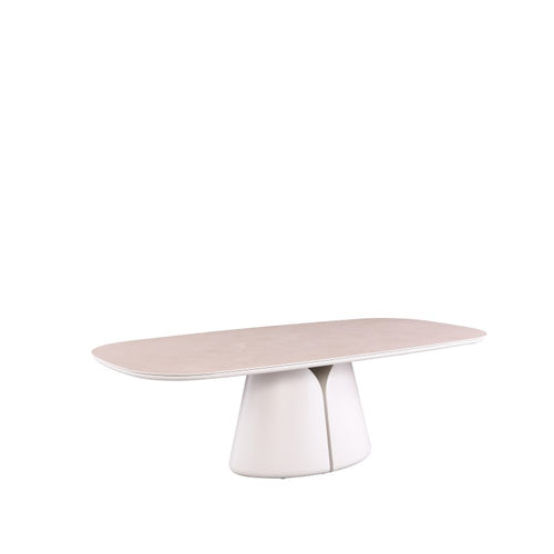 Angled view of the ALMA oval outdoor dining table with softly rounded tabletop