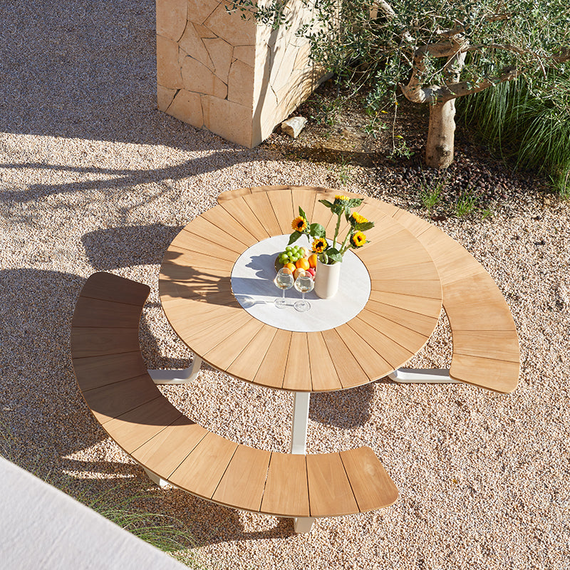 Top view of the ALMA round outdoor dining table and curved seating