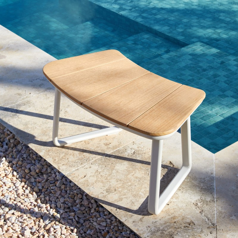 Curved bench seating from the ALMA outdoor dining set with soft cushions