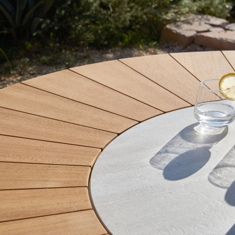 Close-up of the ALMA outdoor dining set tabletop with warm wood slats