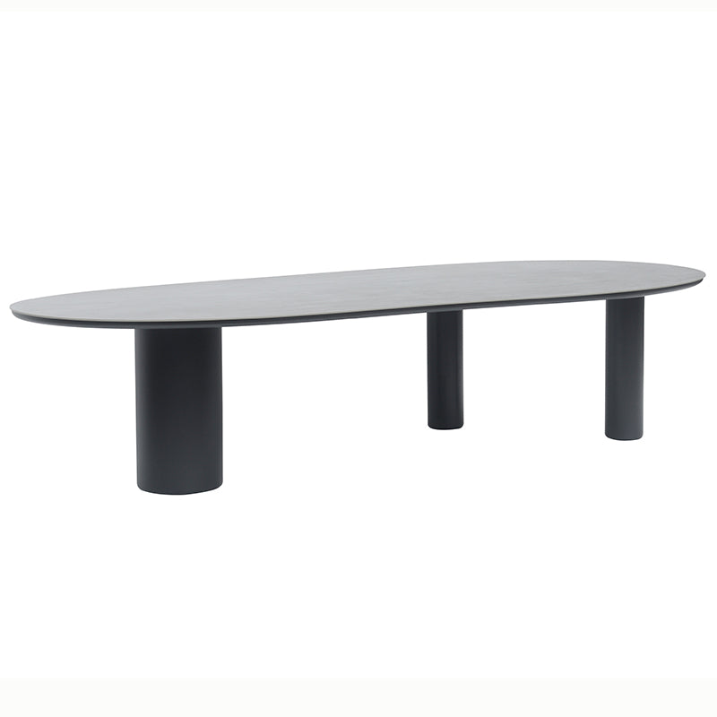 Long view of the AMICO outdoor table with sculptural cylindrical legs