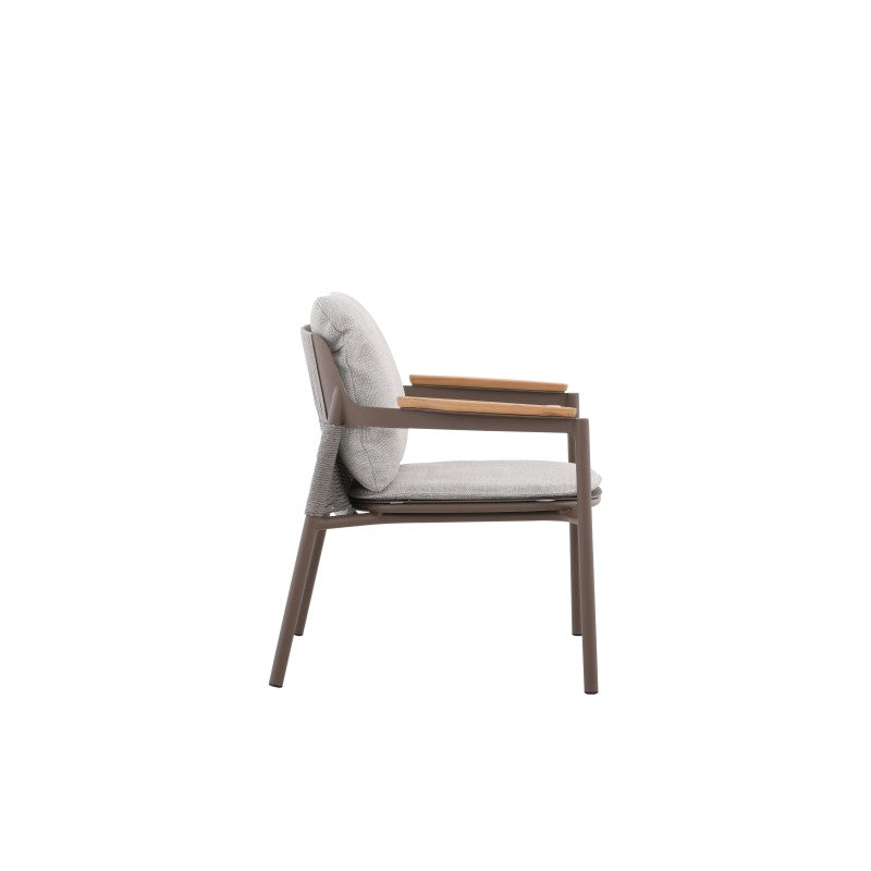 Angled detail of the AURORA taupe outdoor dining chair with cushions and teak arms