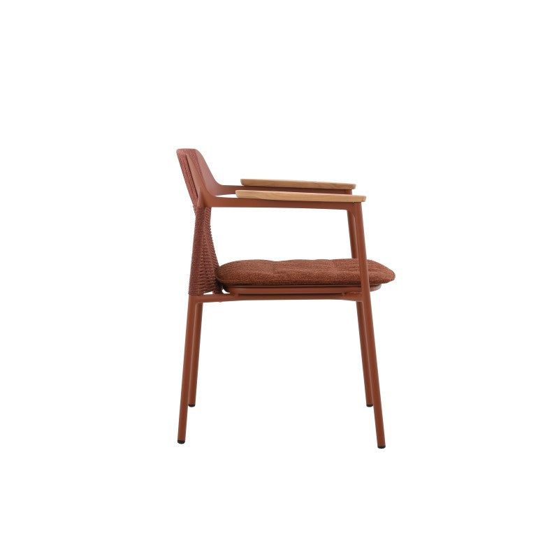 Side view of the AURORA rust red woven outdoor dining chair with teak arms