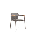 Angled view of the AURORA dark grey woven outdoor dining chair with teak arms