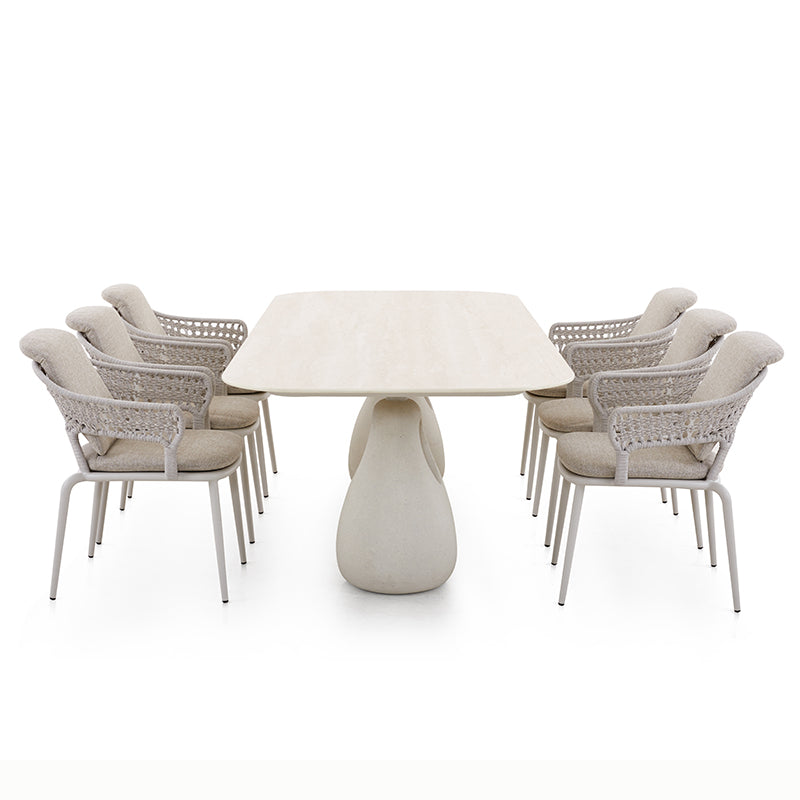 BOSSA outdoor dining set arranged with a long rounded table and dining chairs