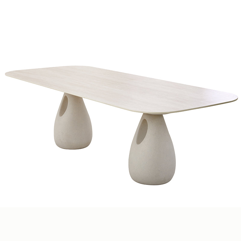 Angled view of the BOSSA outdoor dining table and sculptural bases