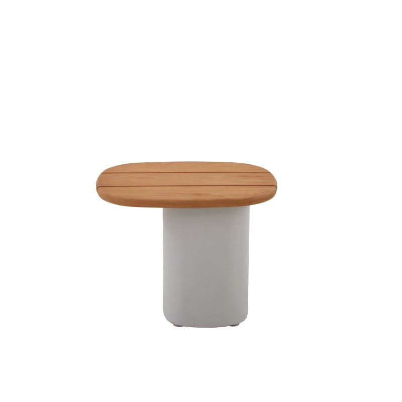 Side view of the COCOON teak outdoor side table with rounded tabletop