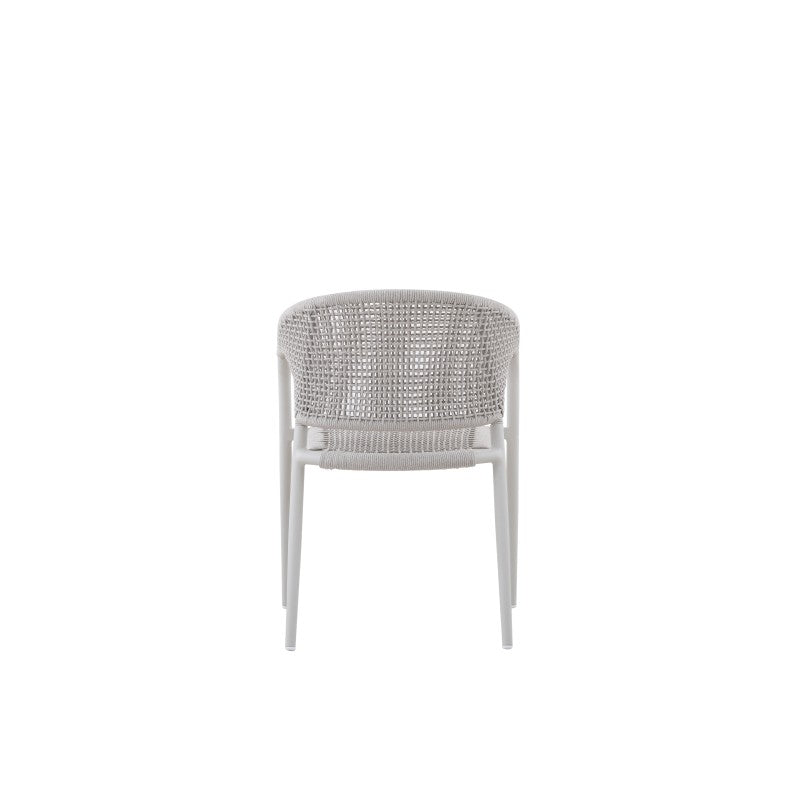 Angled view of the LA TOUR white woven outdoor dining armchair