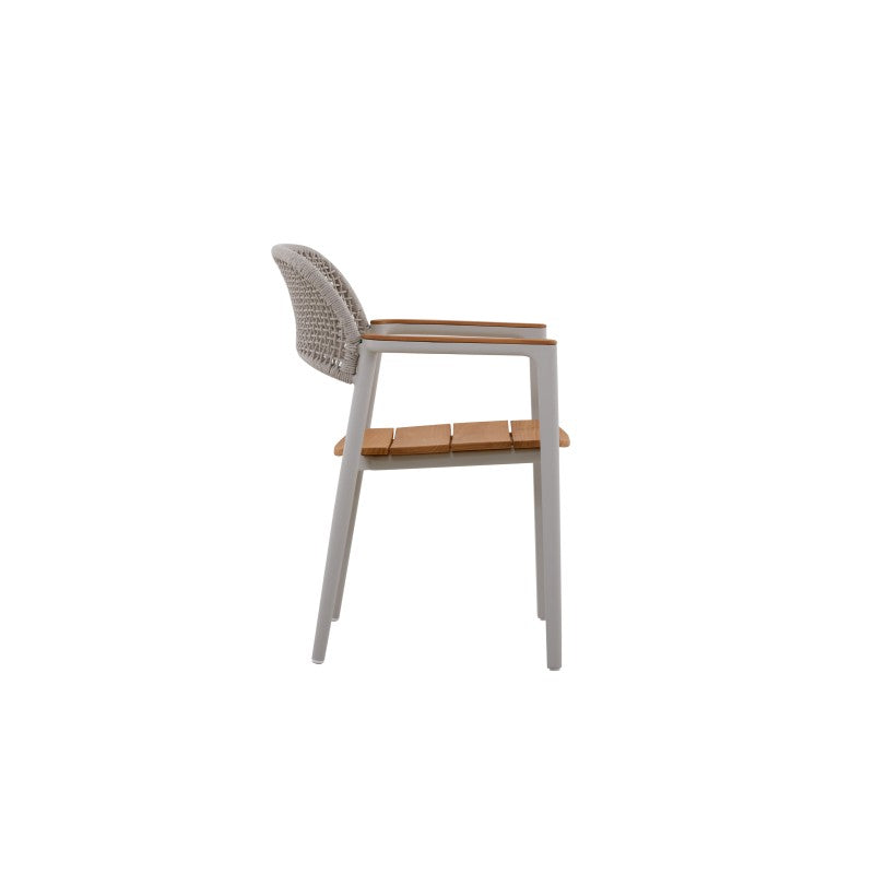 Angled view of the LA TOUR white woven outdoor dining armchair with teak seat