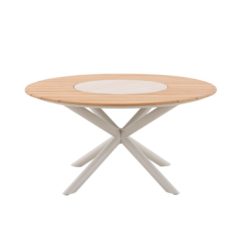 LOOP teak round outdoor dining table arranged with woven outdoor dining chairs
