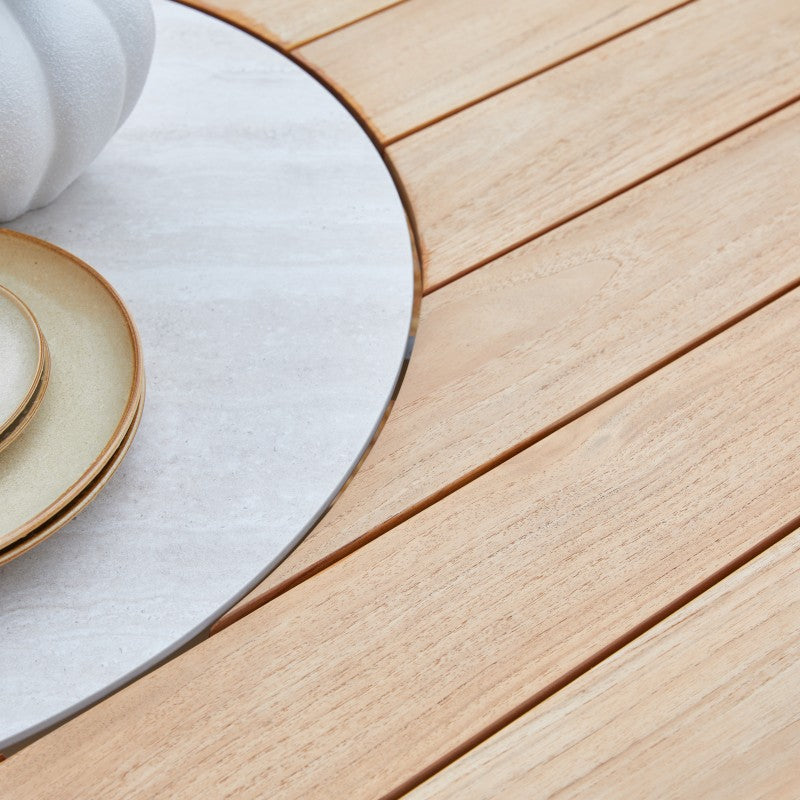 Close-up of the LOOP teak tabletop with slatted surface and circular centre detail