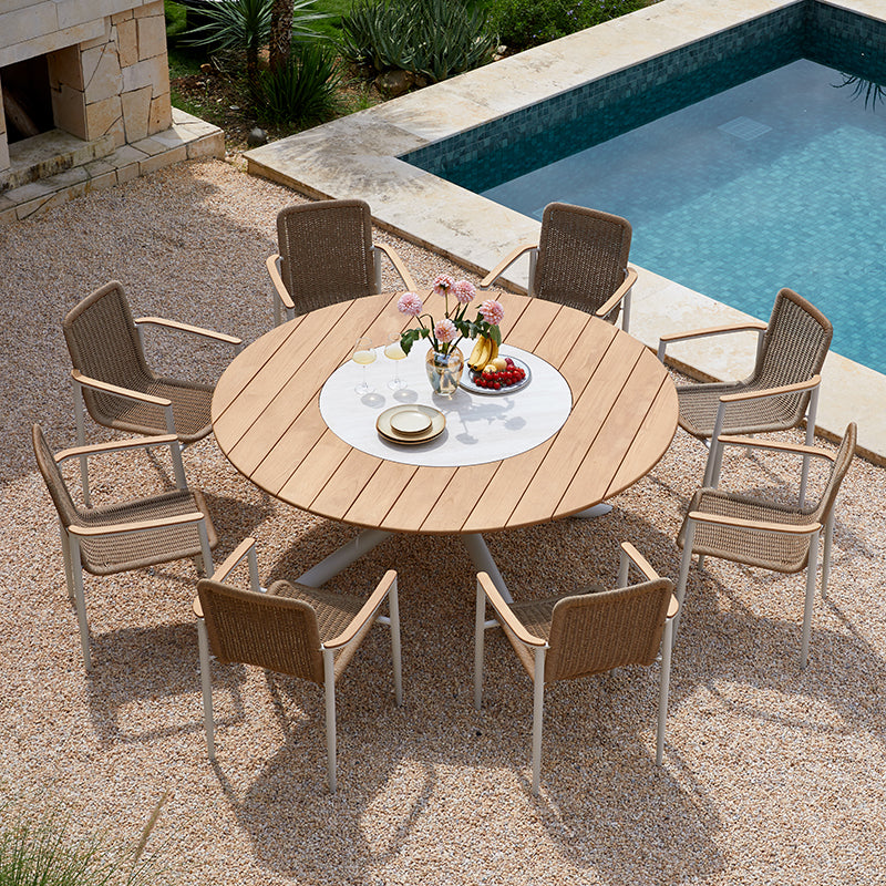 LOOP 8-seater teak outdoor dining table styled with woven dining chairs