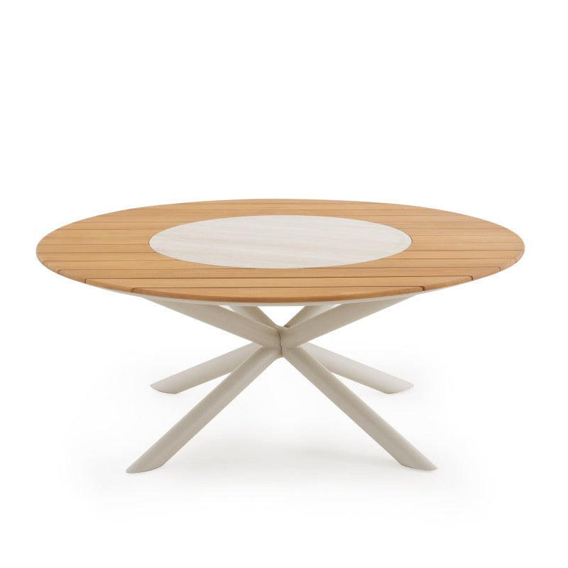 Front view of the LOOP 8-seater teak round outdoor dining table with crossed pedestal base