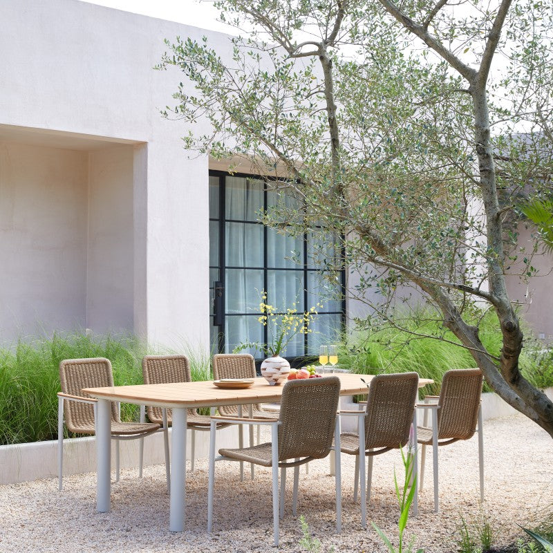 Front view of the MARINE rectangular teak outdoor dining table with rounded corners