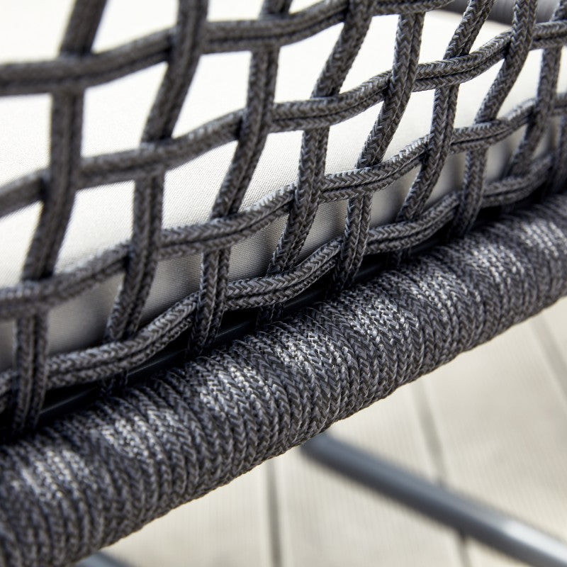 Rear view of the SUNRISE black rope-woven outdoor dining armchair