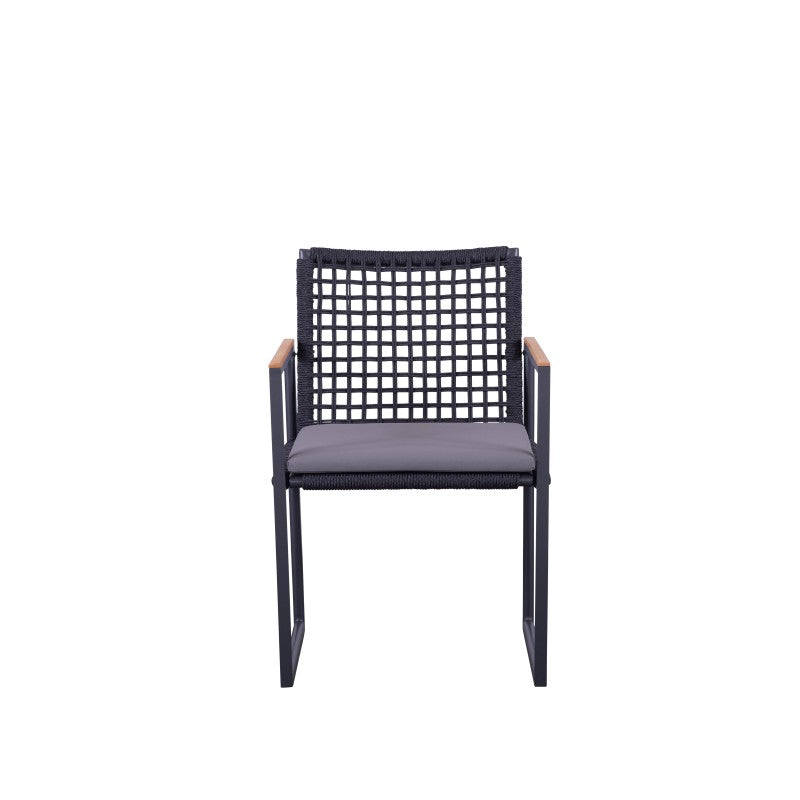 SUNRISE black rope-woven outdoor dining armchair with teak arms and grey cushion outdoors