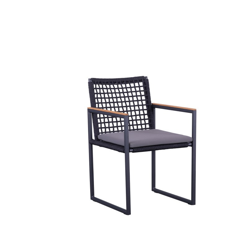 Angled view of the SUNRISE black rope-woven outdoor dining armchair with teak arms