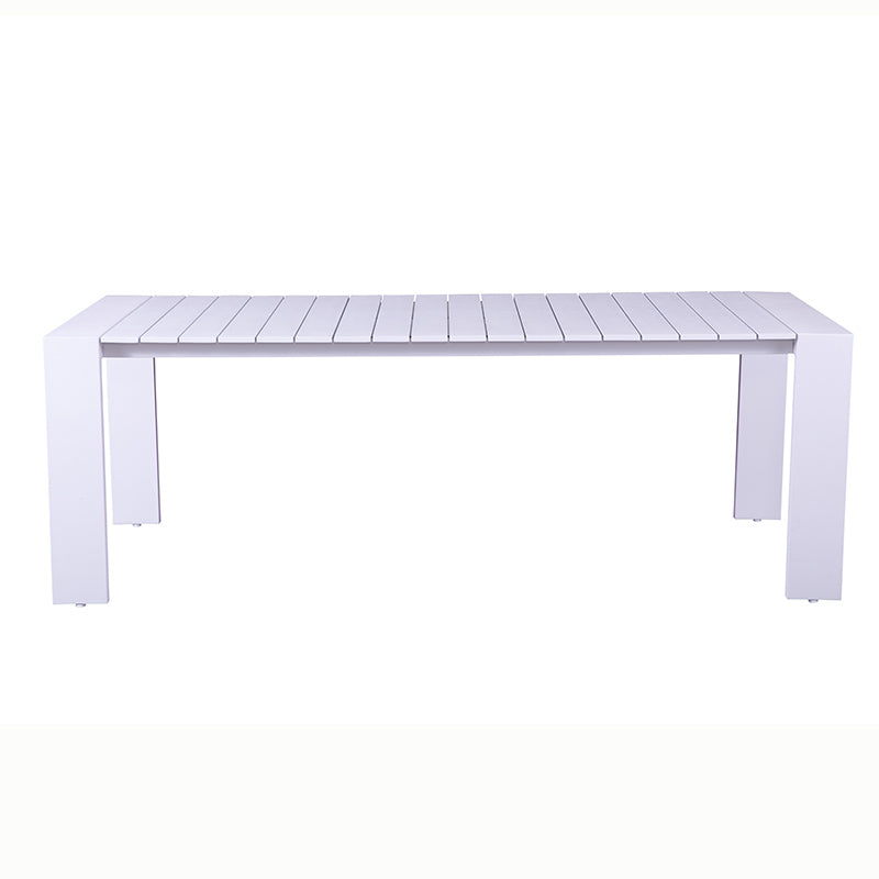 Angled view of the SUNRISE white outdoor dining table with clean four-leg design