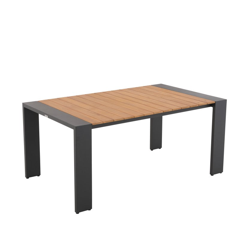 Angled view of the SUNRISE teak outdoor dining table with dark frame