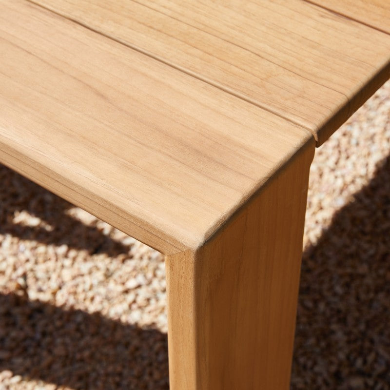 SUNRISE teak outdoor dining set arranged for an outdoor meal