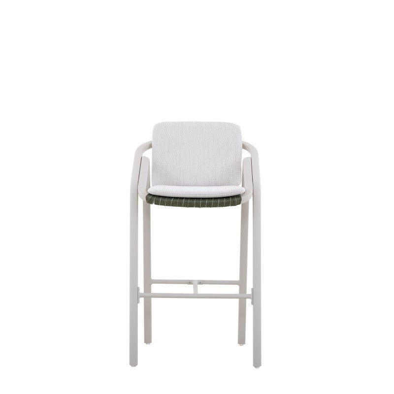 Front view of the VENTO white outdoor bar stool with green woven seat and light cushion