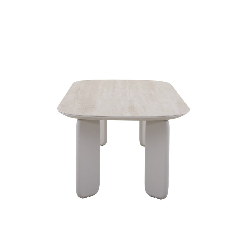 End view of the VENTO outdoor dining table with rounded tabletop and sculptural legs